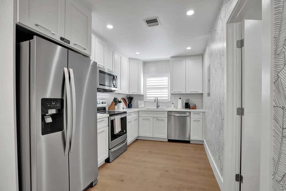 The kitchen is fully stocked with everything you need to make and enjoy a gourmet meal.