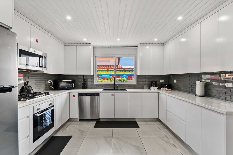 Welcome to the epitome of gourmet living! Our luxurious kitchen boasts top-of-the-line stainless steel appliances, setting the stage for unforgettable culinary adventures in a space where luxury meets convenience.