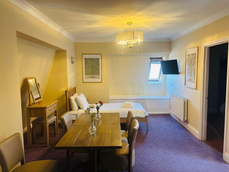 Family Quadruple Room | Blackout drapes, iron/ironing board, free WiFi, bed sheets