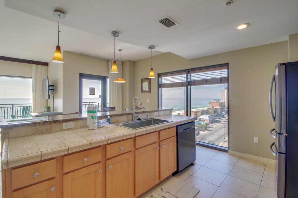 Amazing kitchen with even better views! Complete with large fridge & freezer + dishwasher + stove + microwave + coffee maker + blender!