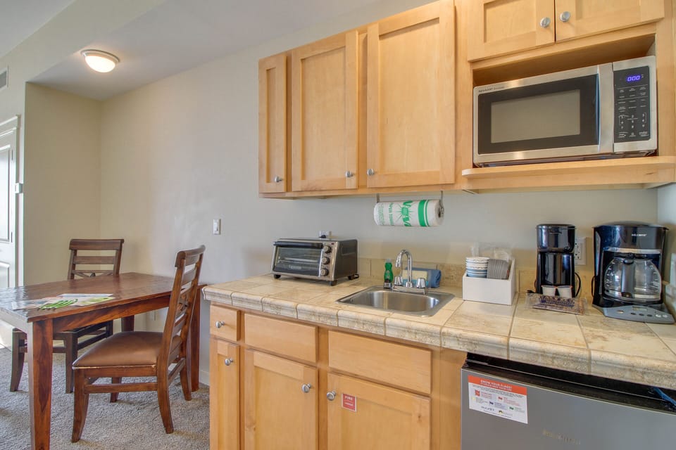 Dining table doubles as a work space! There is plenty of room to set up your laptop!