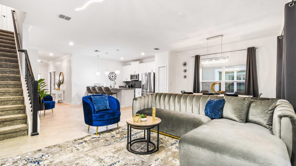 Generous family reunion space, featuring a comfy sofa in a spacious living area for shared moments