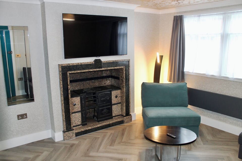 Townhouse Group Suites | Living area | Flat-screen TV