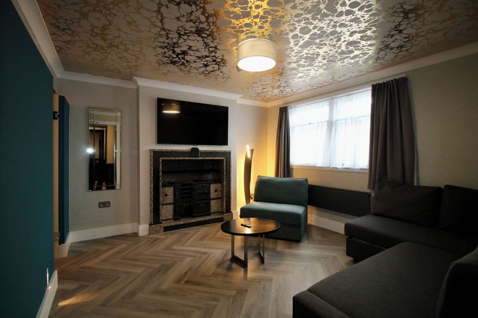Townhouse Group Suites | Living area | Flat-screen TV
