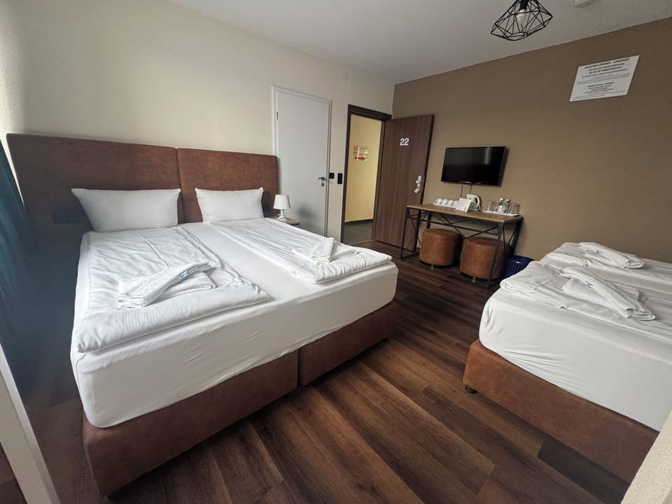 Quadruple Room, Ensuite | Down comforters, minibar, desk, free WiFi