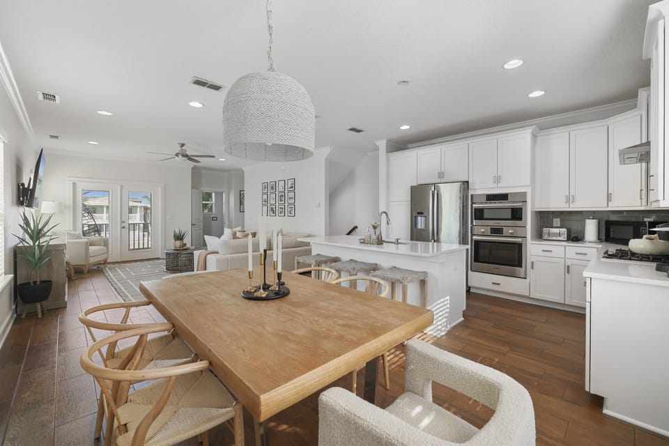 Second-floor open concept living, dining, and kitchen area.  A bright gathering space perfect for relaxing with your group.