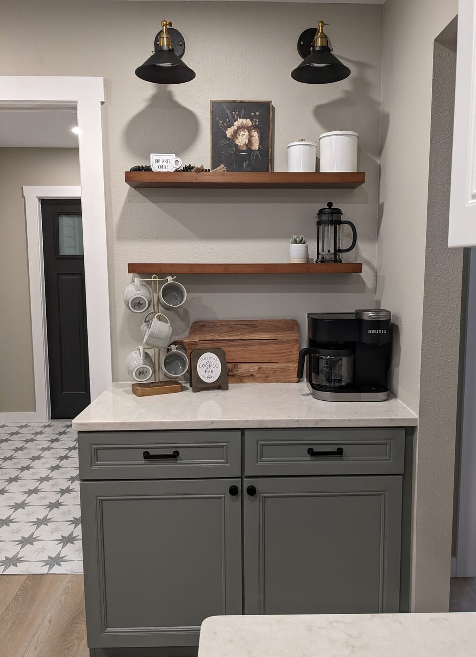 Fully stocked coffee bar includes: loose coffee, K-cups, sugars, and more.