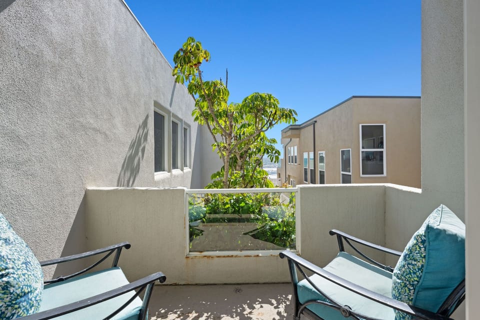 A serene and private outdoor space surrounded by greenery.
