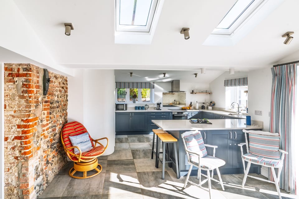 Ground floor:  Garden room and kitchen with sit-up breakfast bar
