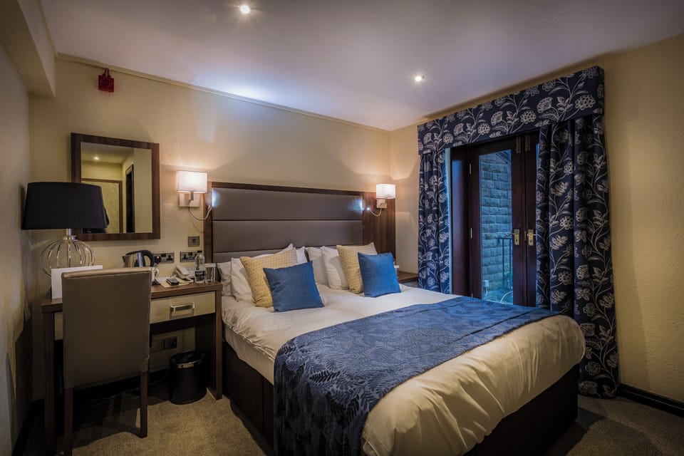 Classic Double Room | Blackout drapes, iron/ironing board, WiFi (free), bed sheets