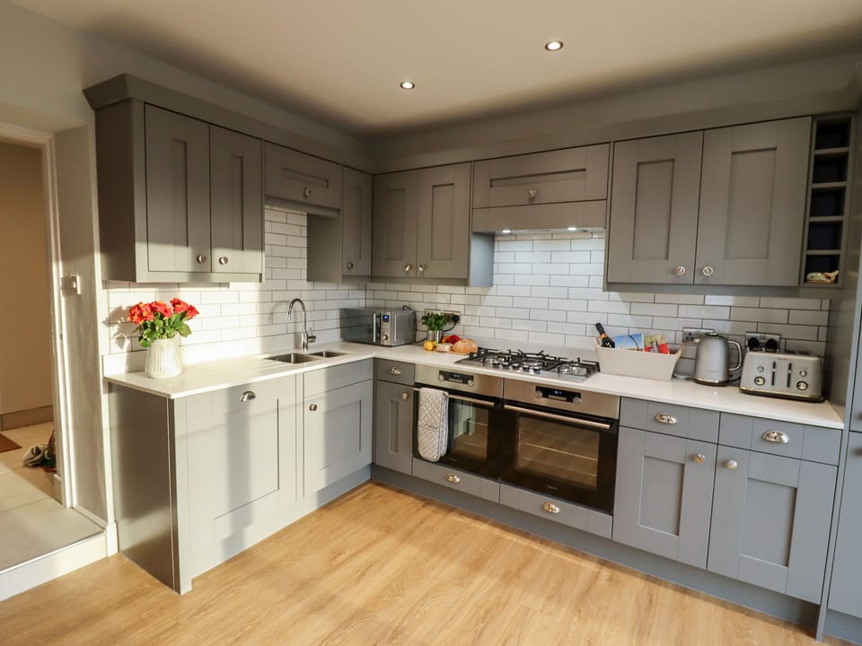 Fridge, electric kettle, cookware/dishes/utensils