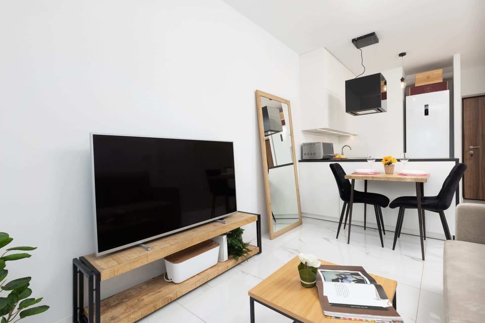 A wider view of the dining area, connected to the living room.
