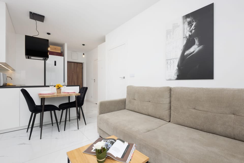 Another angle of the living area with the dining table in the background.
