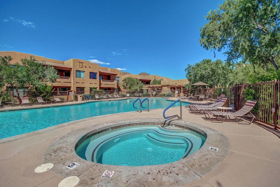 Large heated community pool with spa