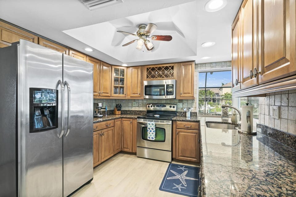 Enjoy Our Modern Electric Kitchen, Complete with Utensils, Small Appliances and Granite Countertops for Fun and Functional Cooking.