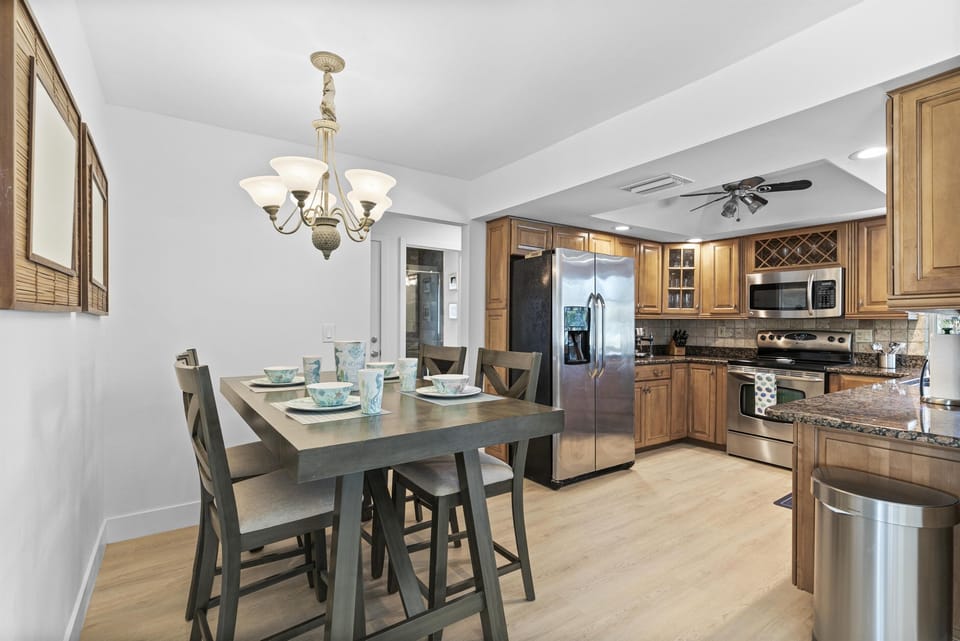 Enjoy Meals and Snacks in this Kitchen Nook Area Feautring High Table and Chairs.