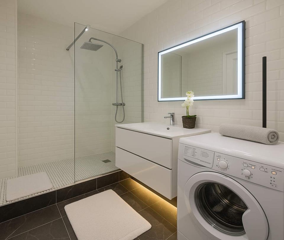 Top washer in the beautiful bathroom with LED lights mirror
