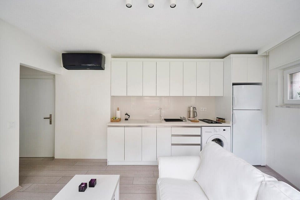 Bright open fully equipped kitchen with an A/C unit:)