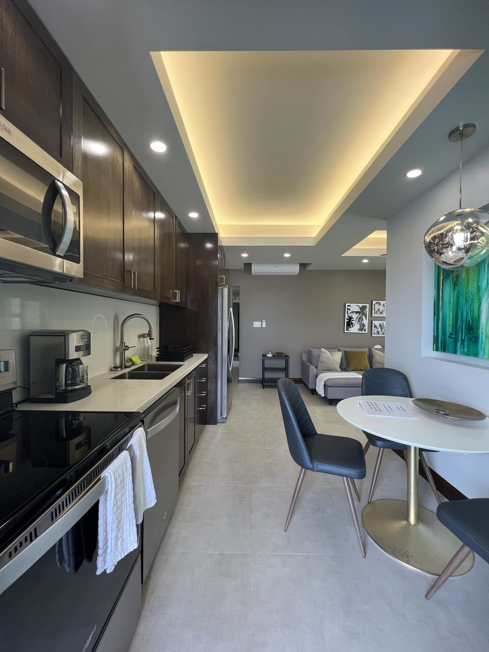 Kitchen area with a table and 3 chairs. 