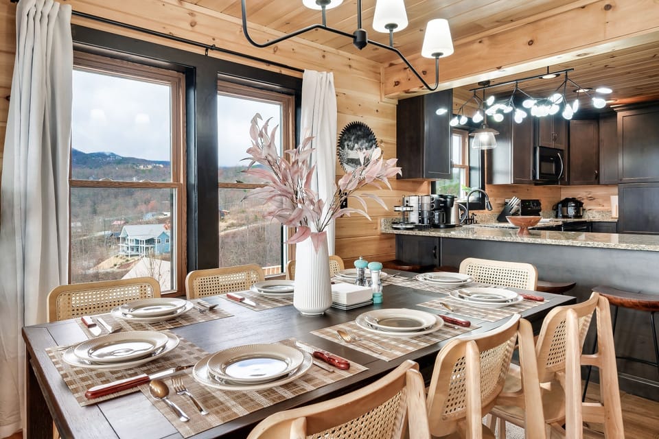 Dining sits 8 people. Bar area sits 4 more. More outdoor dining area on deck.