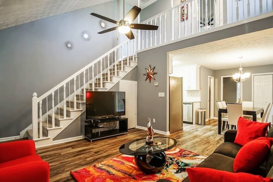 Living room area with flat screen TV, cable and high-speed internet provided