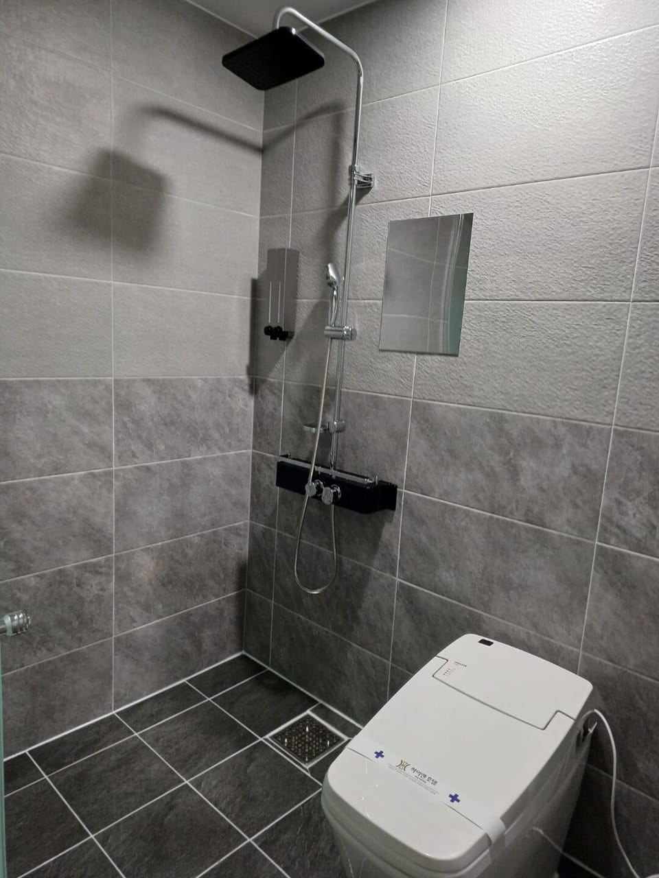 Shower, designer toiletries, hair dryer, bathrobes