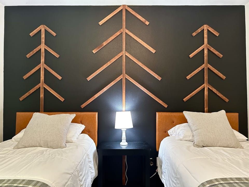 Wake up in the trees!  Bedroom 3 - The Tree Room offers 2 Twin XL (extra long) beds.  We also have a kit that joins the two beds together to make it a king bed.