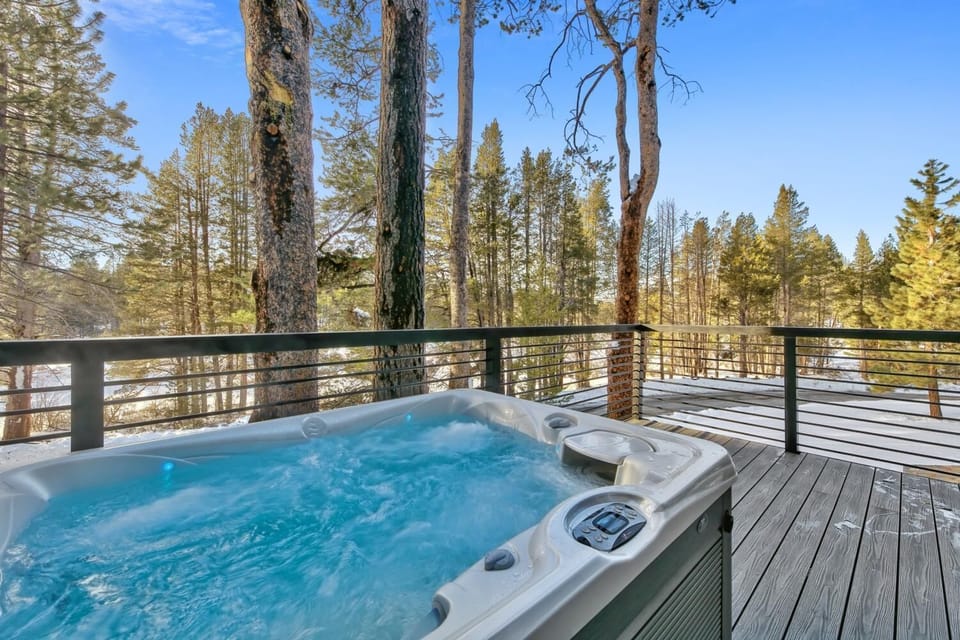 Soak in bubbling waters while surrounded by towering pines and crisp mountain air on your private deck.