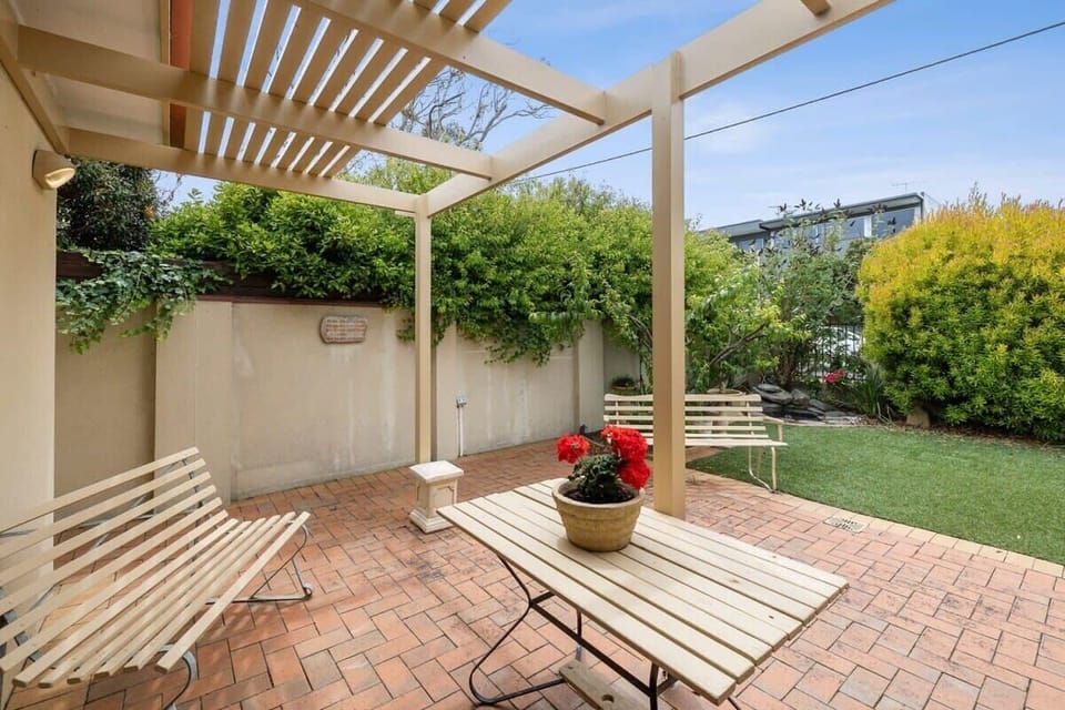 North-facing pergola with all-day sunshine, a BBQ and garden aspect