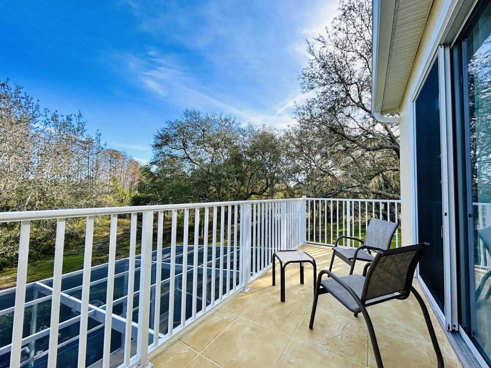 Lovely balcony featuring a small table and chairs to enjoy the beautiful view.