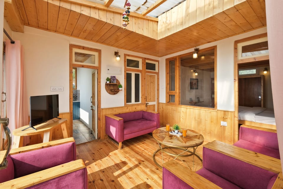 Luxury Room, 2 Bedrooms, Kitchenette | Living area | 32-inch LED TV with cable channels, heated floors