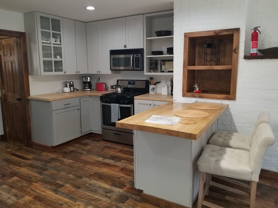 Fully stocked kitchen for cooking large meals.
