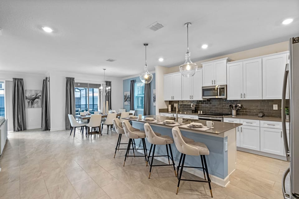 Dining table + kitchen counter will comfortably seat up to 14 people! 