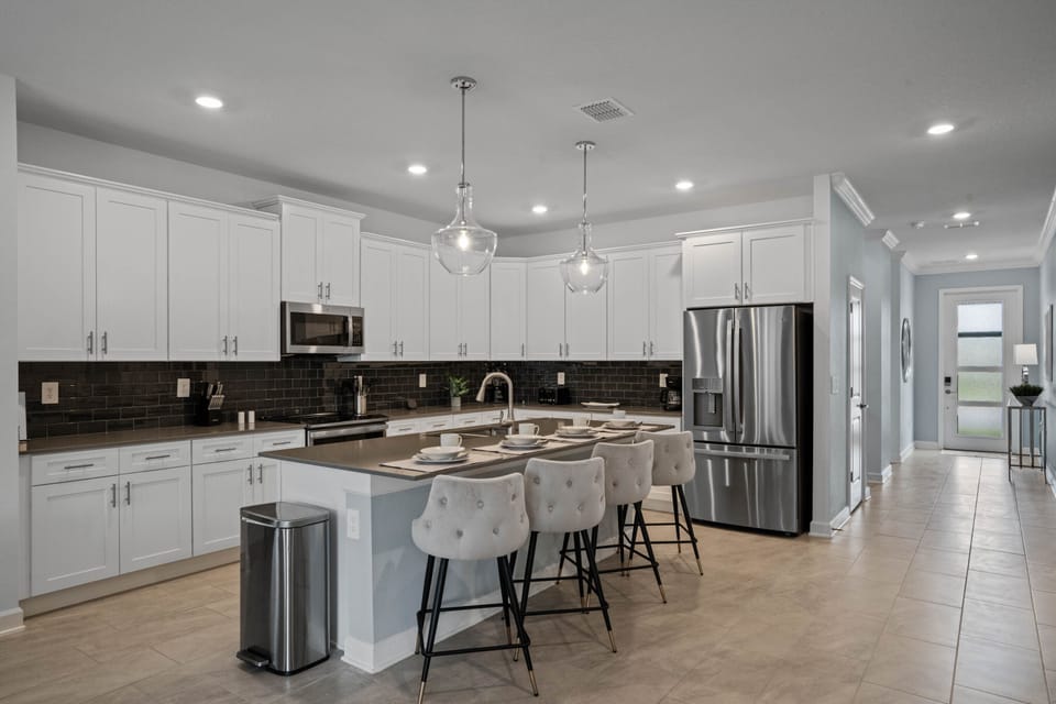 State-of-the-art kitchen is FULLY STOCKED with multiple sets of dinnerware
