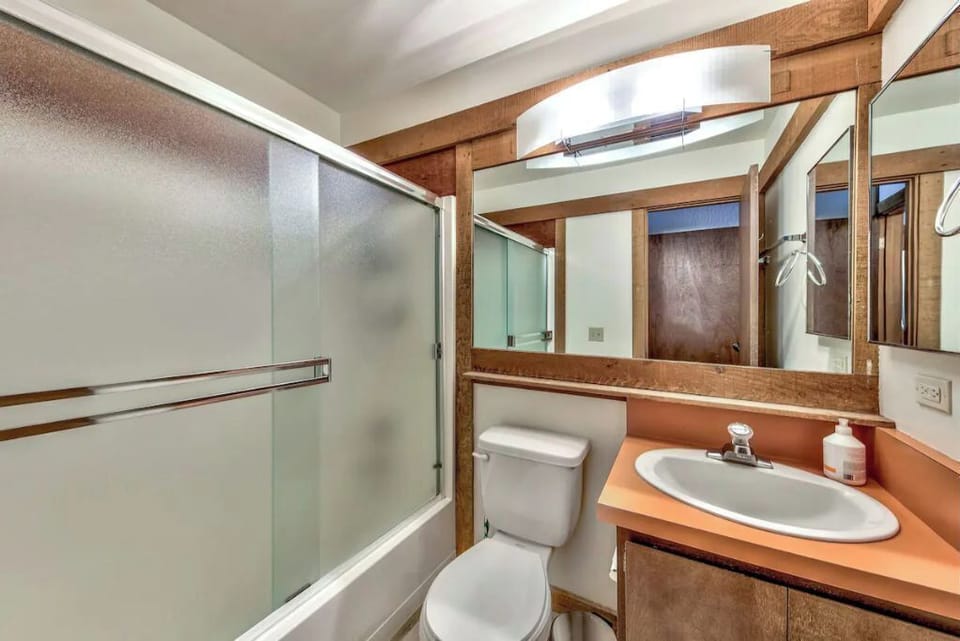 Hallway bathroom with tub shower.