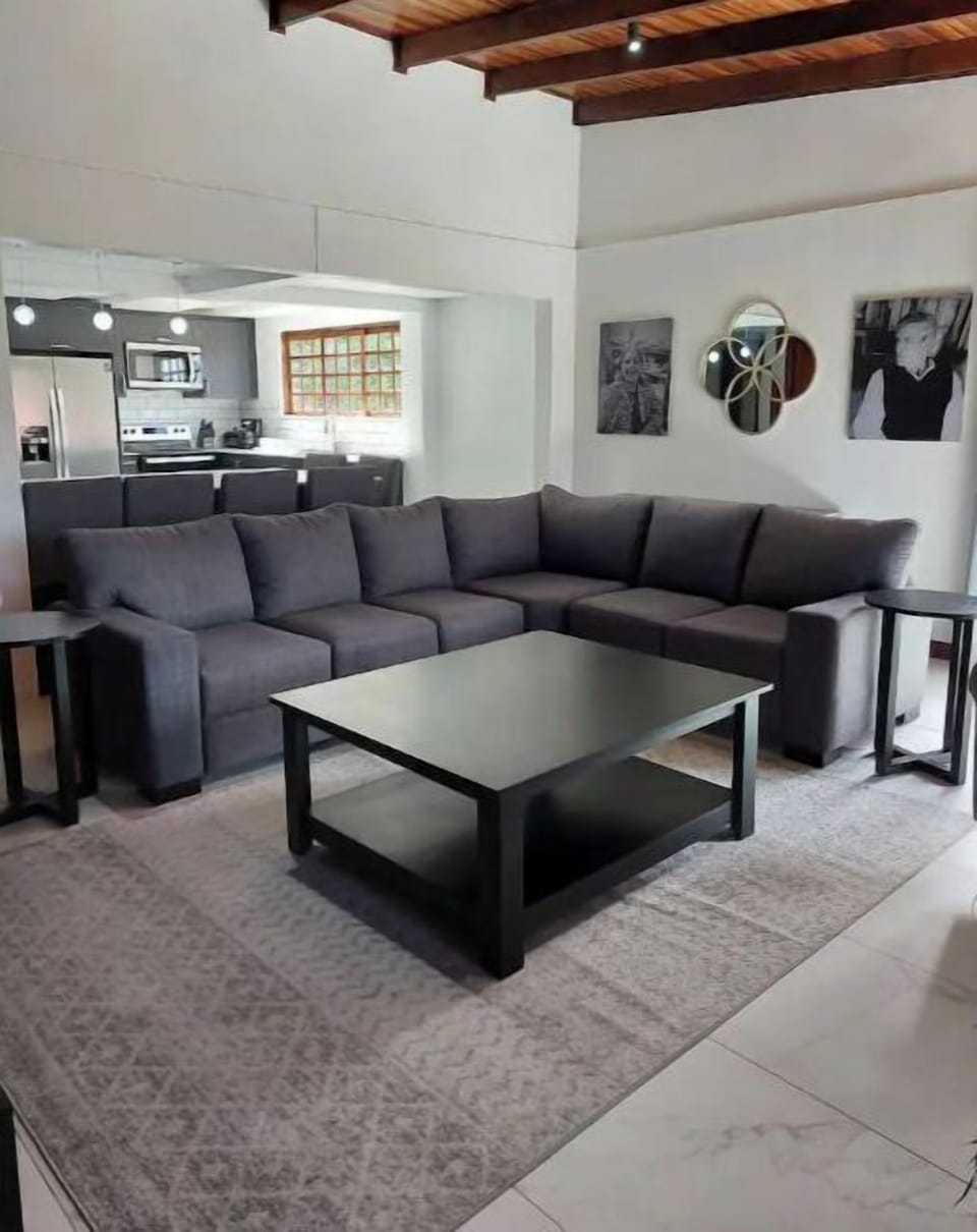 Comfortable sectional and plenty of accent tables!