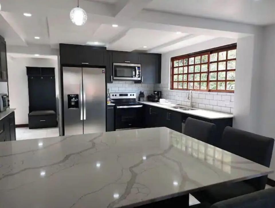 Laundry room, pantry and a country bench complement this kitchen. 
