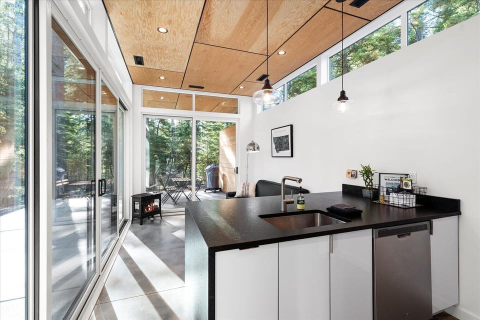 Open concept kitchen and living area with full size appliances
