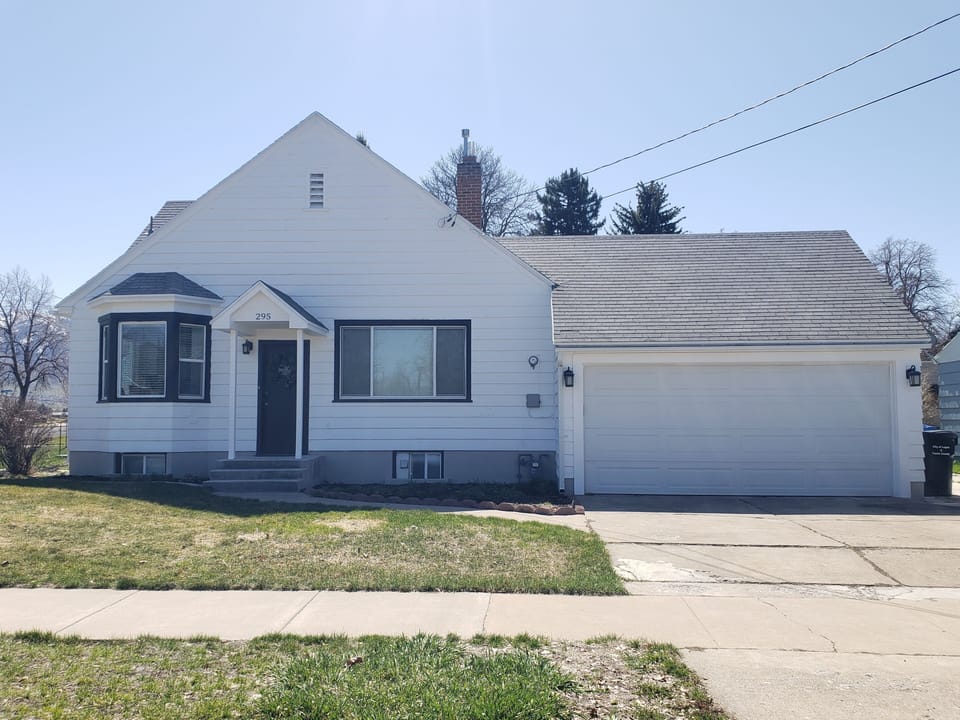 Side of the home and garage