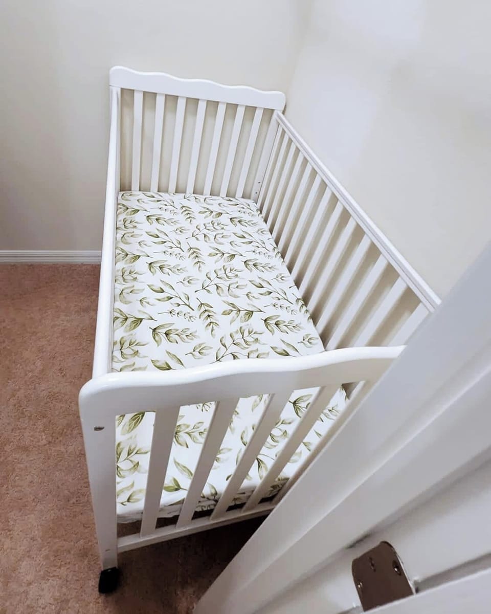 Let your little one sleep peacefully in this full sized crib in the master bedroom.