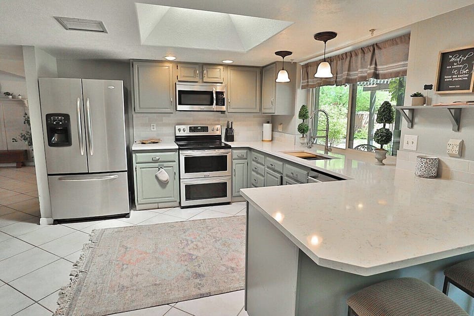 Kitchen with updated counter tops and back splash