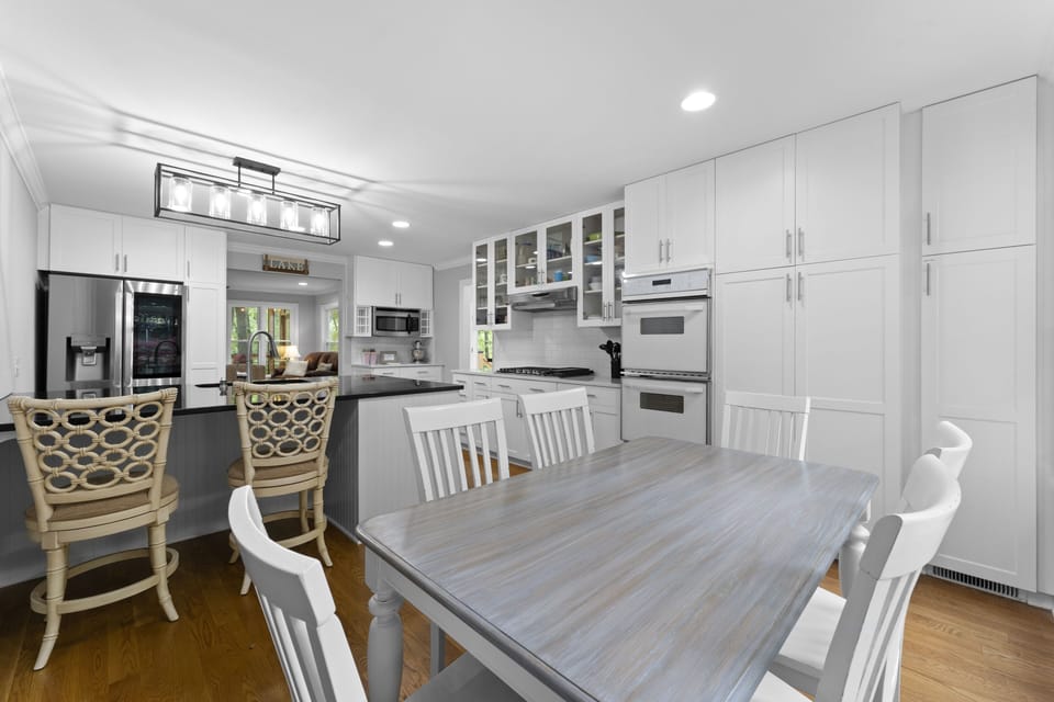 Kitchen with eat in bar and seating. Well appointed with all the extras
