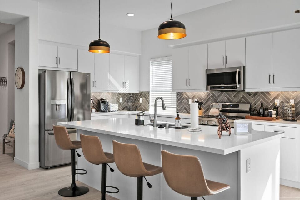 A sleek kitchen with a spacious island
