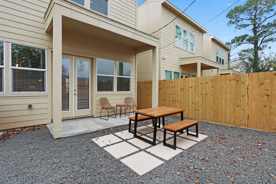 Private backyard with designated dining station for your enjoyment. 