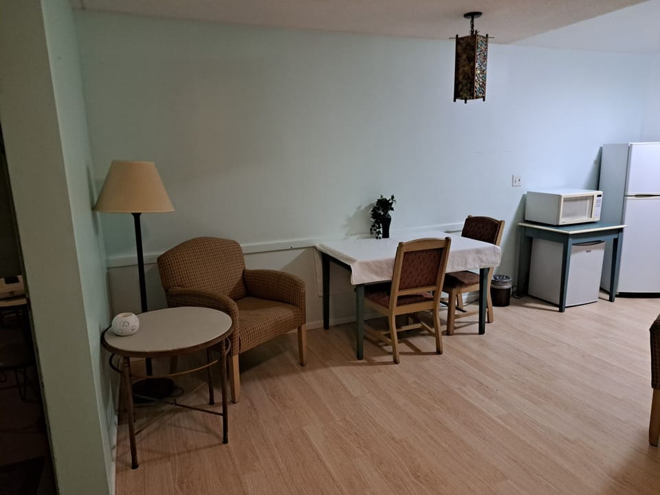 Exclusive Room, 2 Queen Beds | Living area | 42-inch TV with cable channels, books, stereo