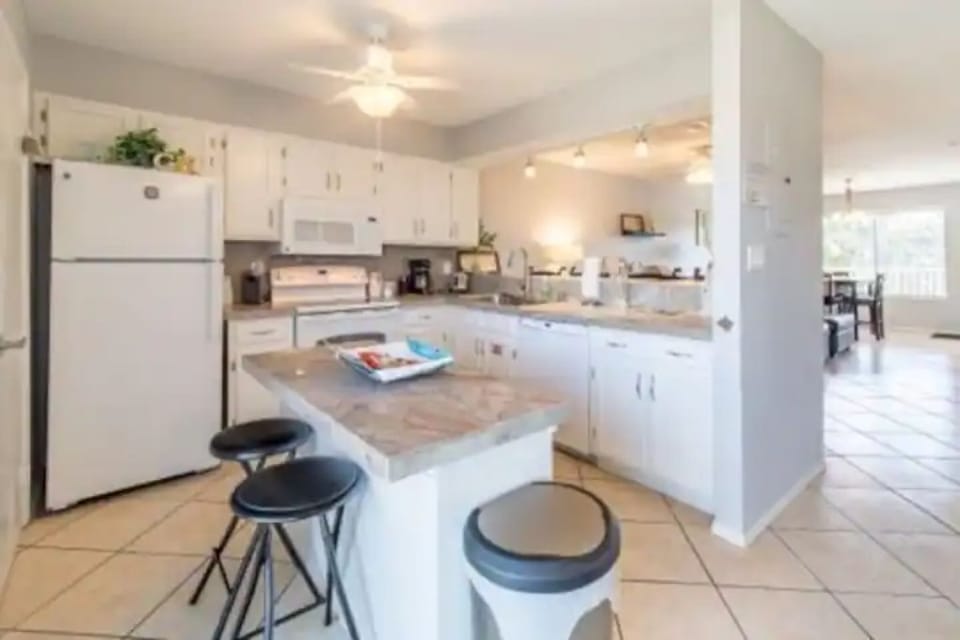 Island in kitchen with additional seating.