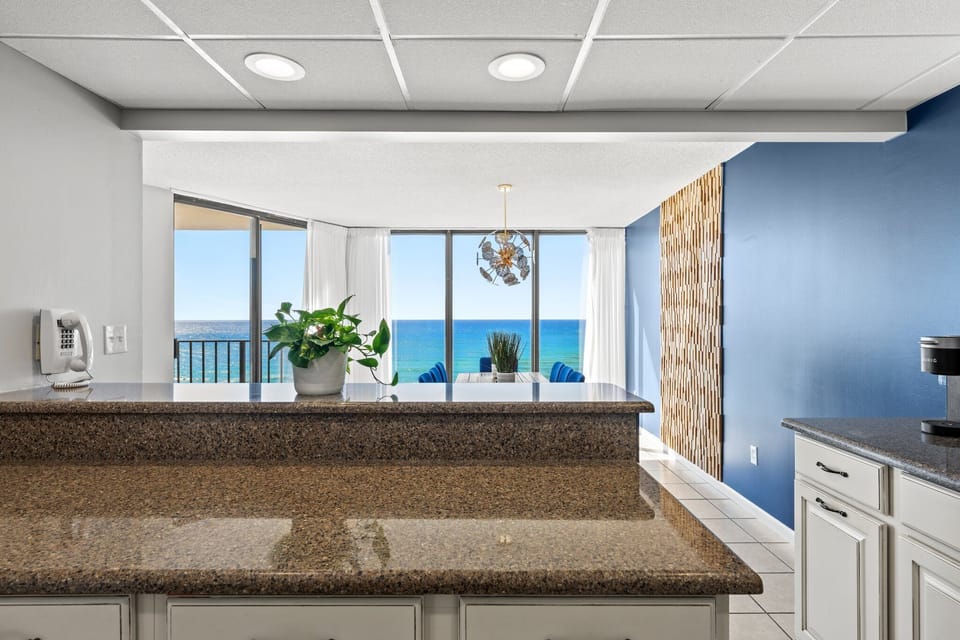 Modern kitchen with ocean views through large windows