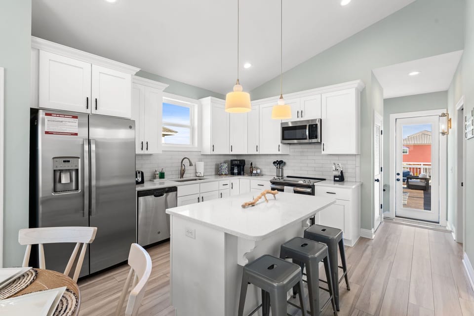 A fully stocked coffee bar with amazing syrups, creamer, sugar, and k-cups is ready to make every morning perfect for you