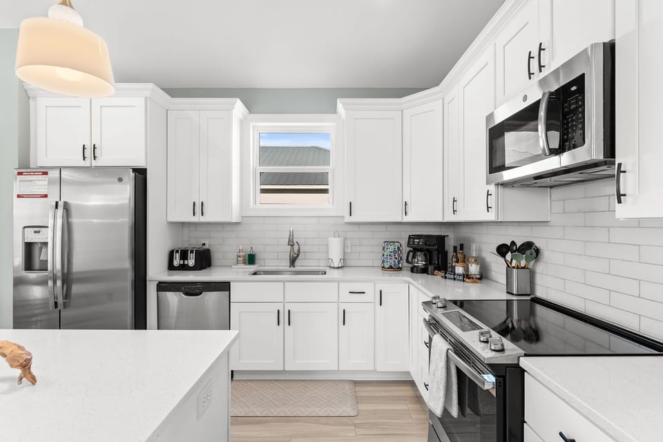 The chef's kitchen is on the 2nd floor and is stocked with premium utensils, cookware, plates, and glasses