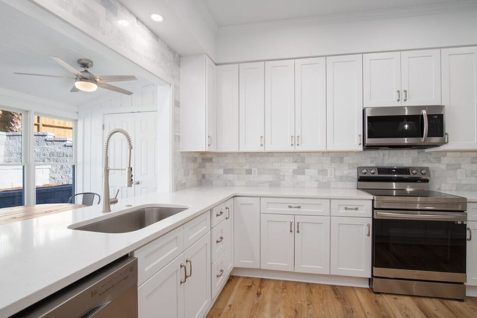 All new stainless steel appliances and farmhouse sink.